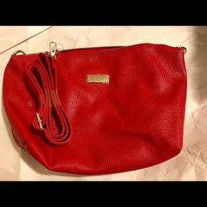 Red BCBG bag. New no tags. Handle attached inside